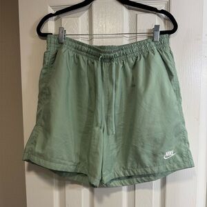 Nike dusty green swim trunks. Elastic drawstring waist. 2 front & 1 back pocket